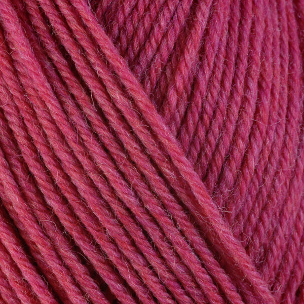 Peony 33148, a bright heathered pink skein of washable worsted weight Ultra Wool yarn.