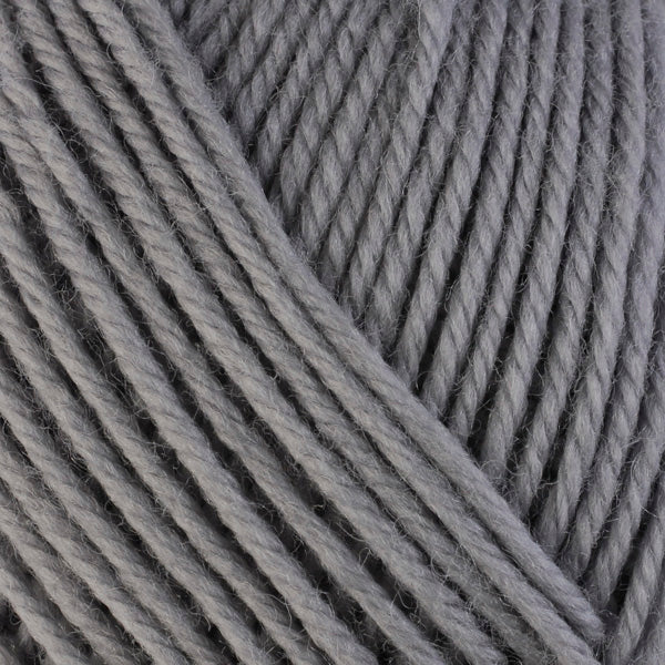 Smoke 3306, a light grey skein of washable worsted weight Ultra Wool yarn.