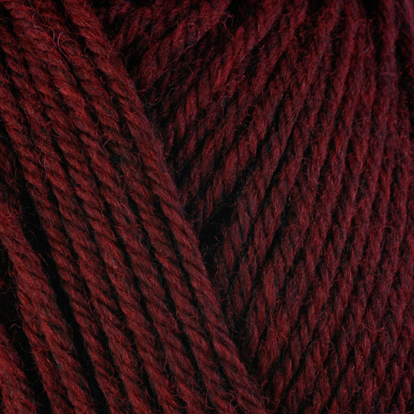 Sour Cherry 33145, a dark candy red skein of washable worsted weight Ultra Wool yarn.