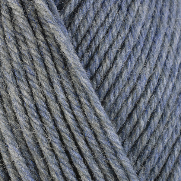 Stonewashed 33147, a light heathered blue-grey skein of washable worsted weight Ultra Wool yarn.