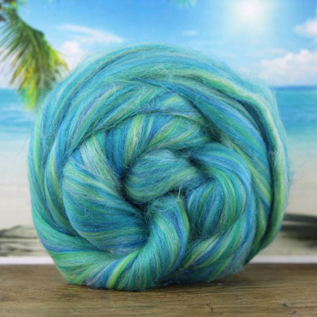 Color it calls me. An aqua blue and green blend of merino and stellina spinning fiber.