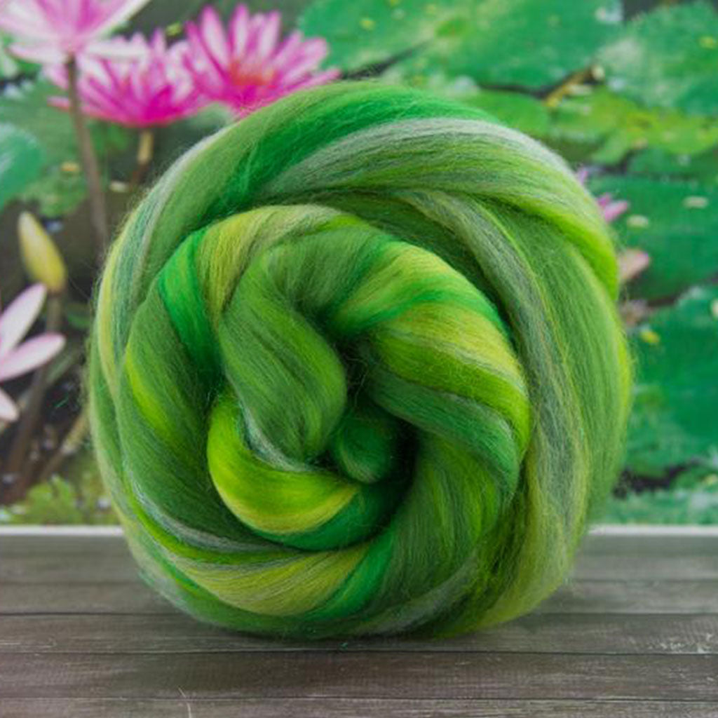 Color kissed a frog. A green and yellow blend of merino and stellina spinning fiber.