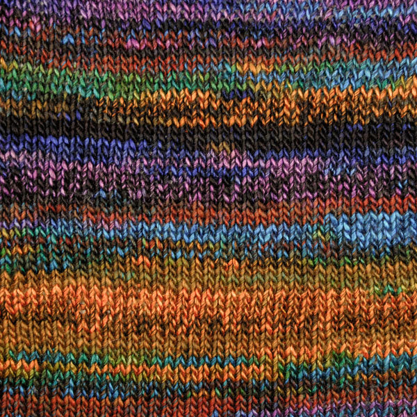 Viola 6859, a variegated pink, green, yellow black and blue skein of Berroco Millefiori Light