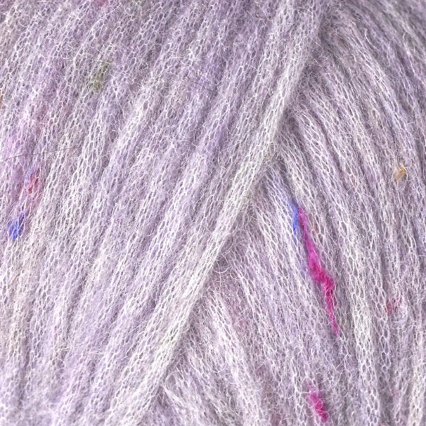 Color Plum 3212. A light purple speckled ball of Berroco Mochi yarn.