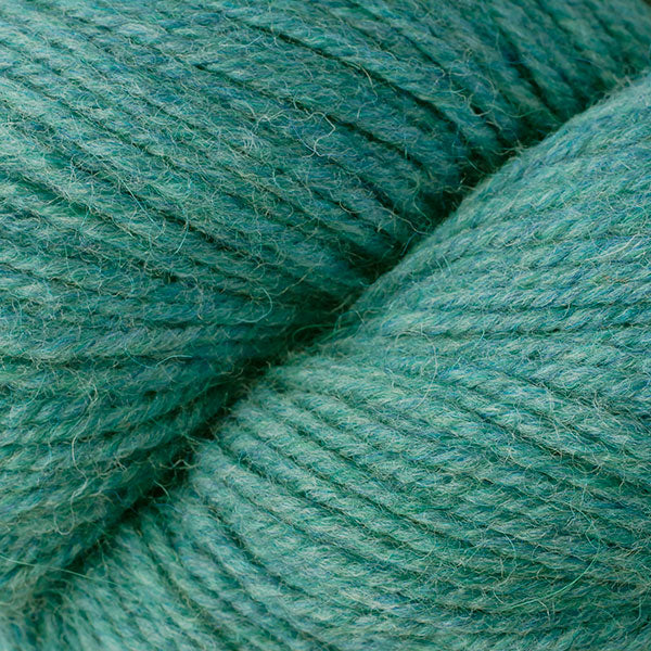 Turquoise Mix 6294, a pale heathered blue skein of Ultra Alpaca Worsted.