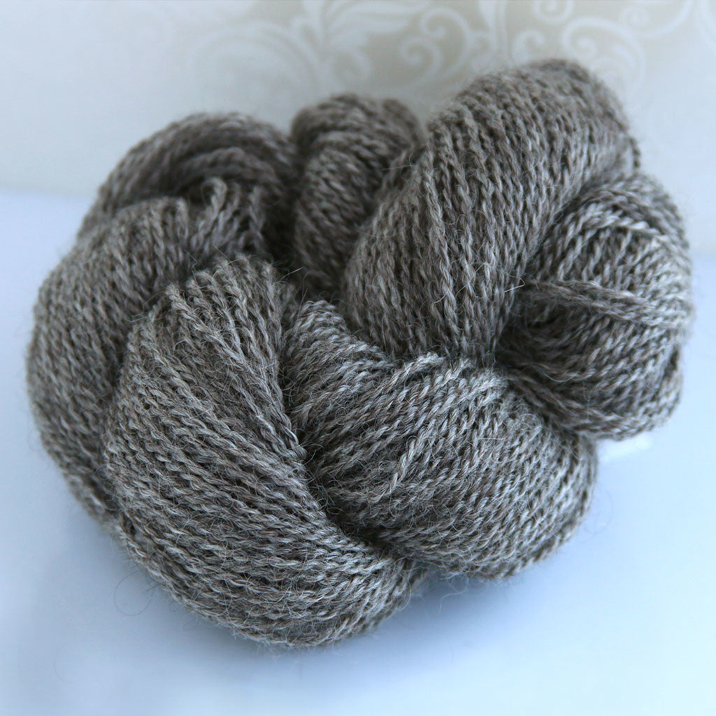 Color Ariana 2017. A natural mid grey 100% wool sport weight yarn from Spoiled Sheep Yarn.