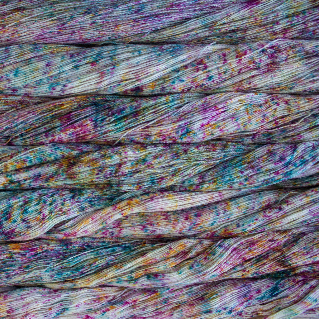 Color Dizfraz SA734. A hand dyed speckled skein of Malabrigo Silkpaca Yarn.