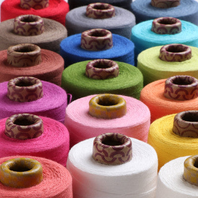 Cones of Ashford Yoga Yarn in various colors