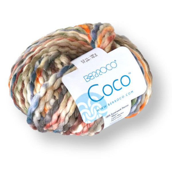 A ball of Berroco Coco  yarn in the colorway Forest 4904.