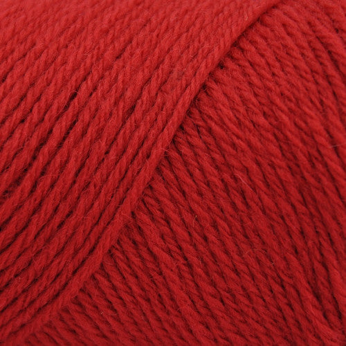 Bright red wool yarn in cones