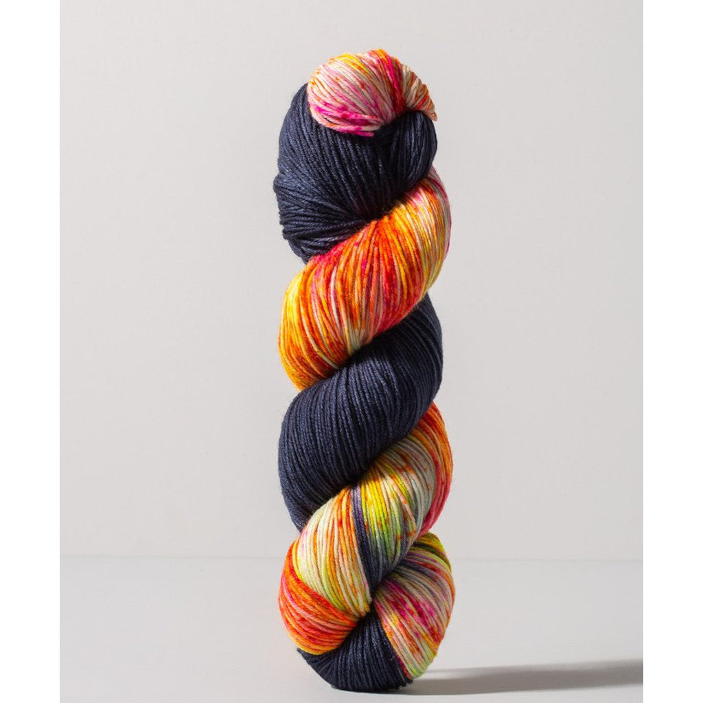 Gusto Wool Carmen Fingering 1402 - navy colorway with speckled white, yellow, pink and bright orange