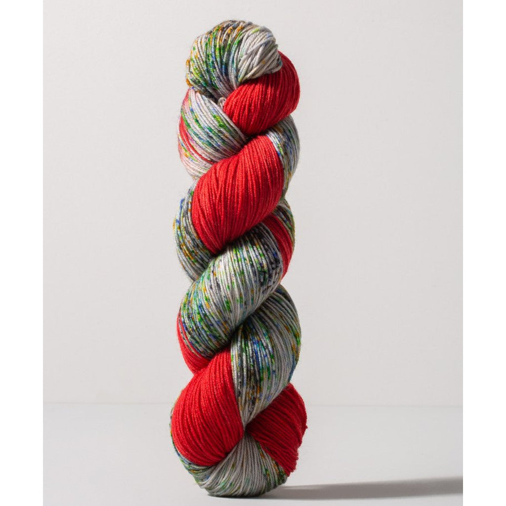 Gusto Wool Carmen Fingering 1407 - a bright red colorway with speckled white, blue, green and yellow