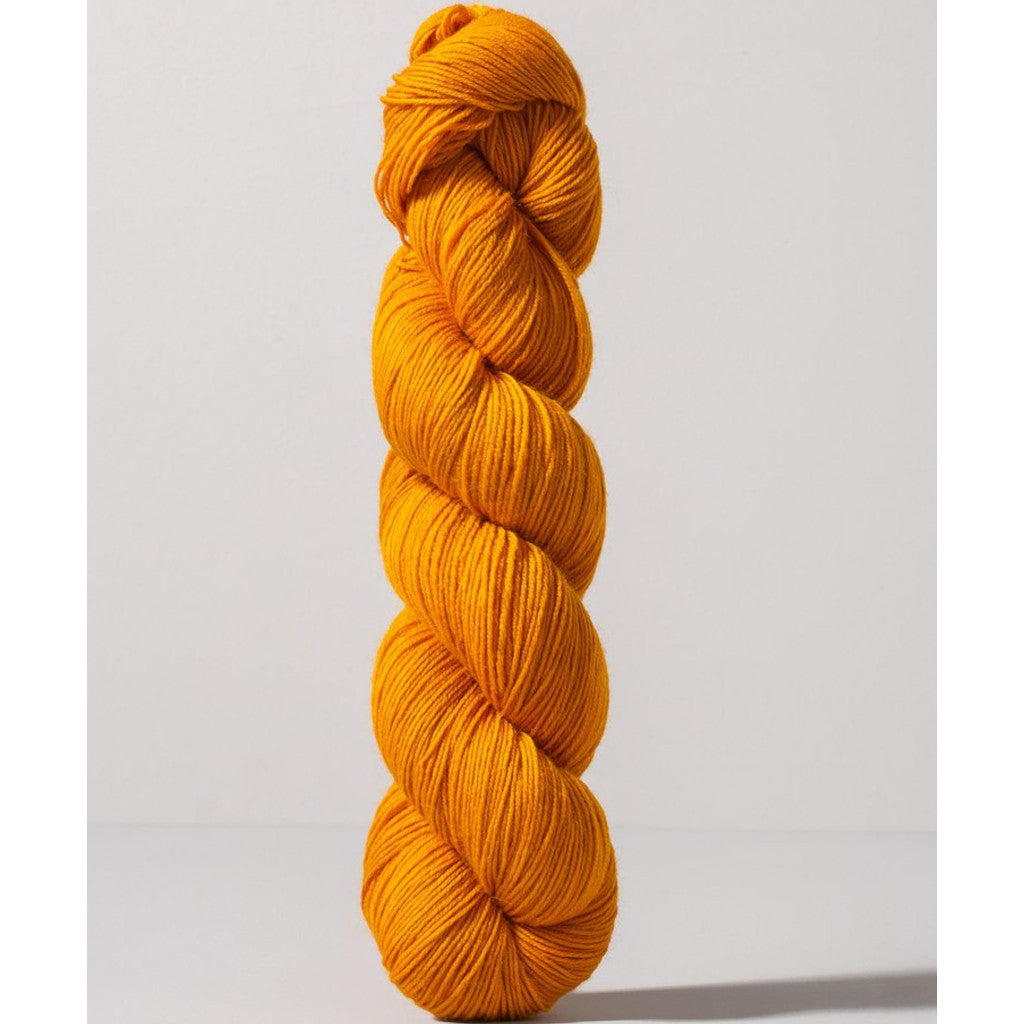 Gusto Wool Core Fingering 1024 - a dark yellow-orange colorway