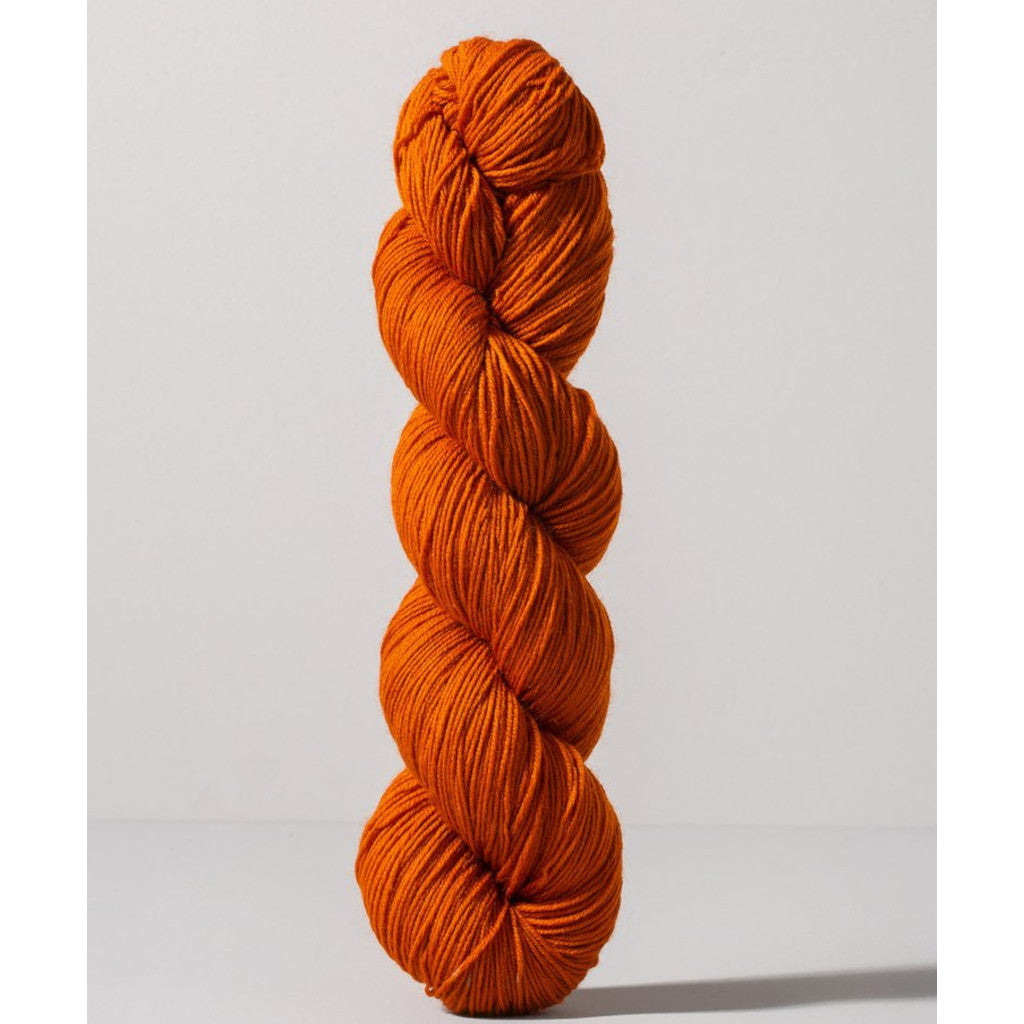 Gusto Wool Core Fingering 1027 - a dark orange colorway