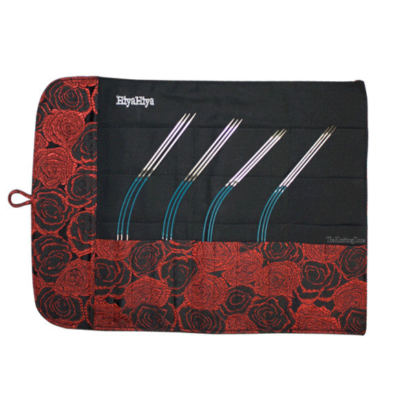 A black and red brocade cotton knitting needle case with 4 sets of flyer knitting needles