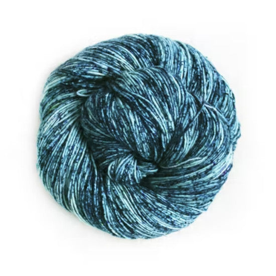Malabrigo Mechita Poipu Yarn - a speckled light and dark blue colorway