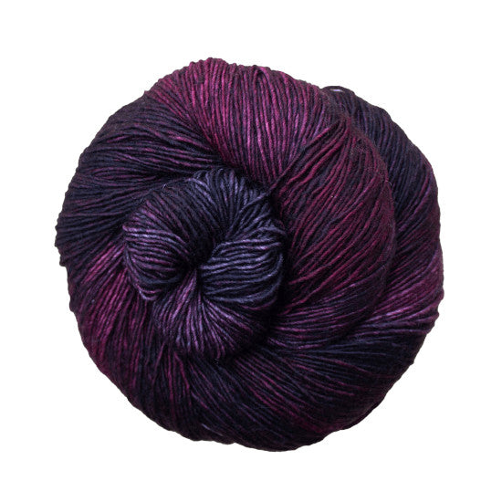 Malabrigo Mechita Swamp Yarn - a magenta and dark purple colorway