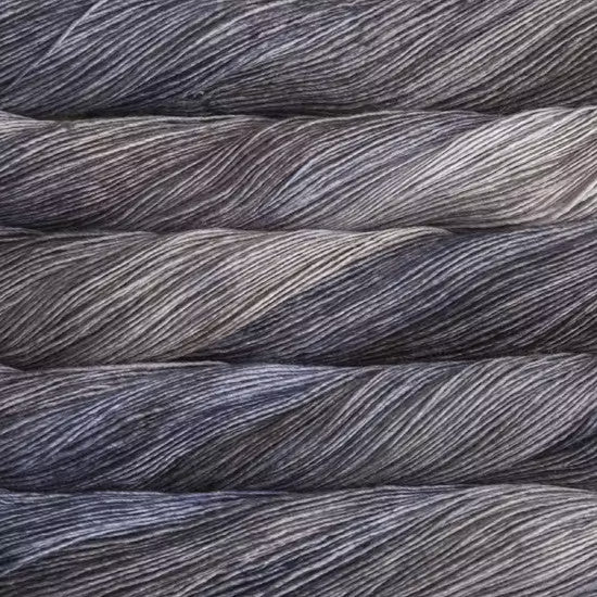 Malabrigo Mechita Unicorno Yarn - A variegated blue-grey and tan colorway