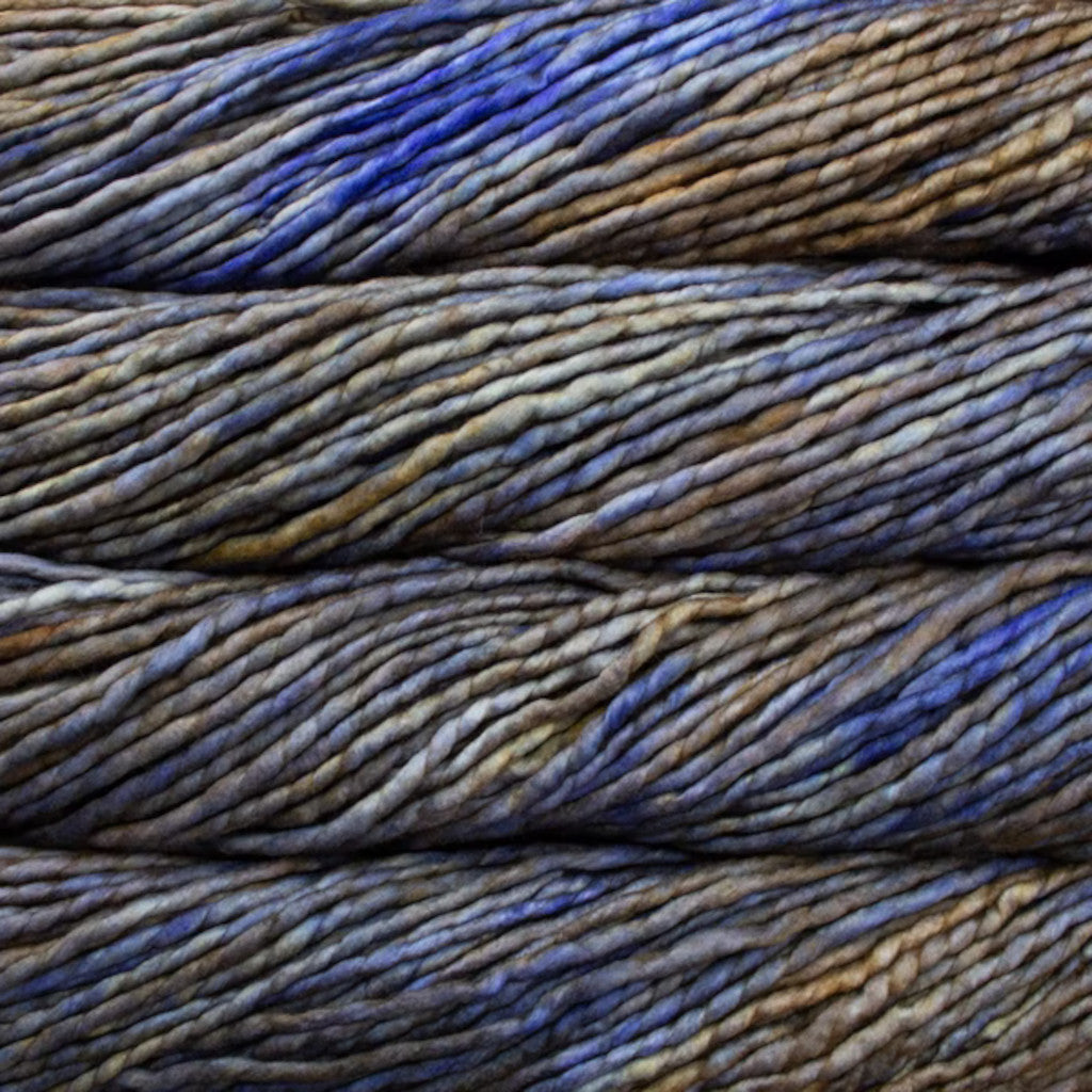 Color: Mercurio 187. A blue, grey, and gold variegated variant of Malabrigo Rasta yarn. 