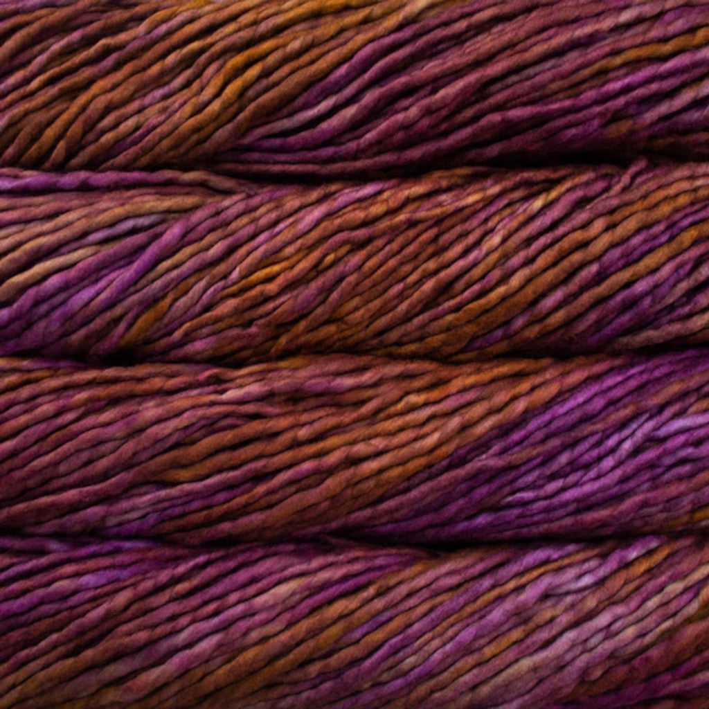 Color: Neptuno 188. An orange and pink variegated variant of Malabrigo Rasta yarn.