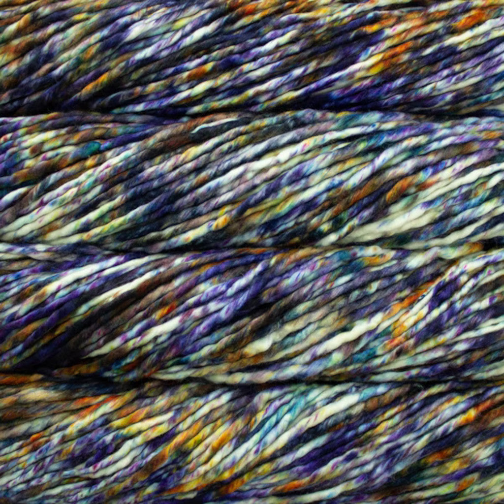 Color: Trompo 191. A blue, purple, yellow and white speckled yellow variant of Malabrigo Rasta yarn.