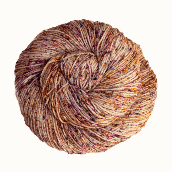 Malabrigo Sock Yarn in Sock - a tan colorway with speckles of yellow and purple