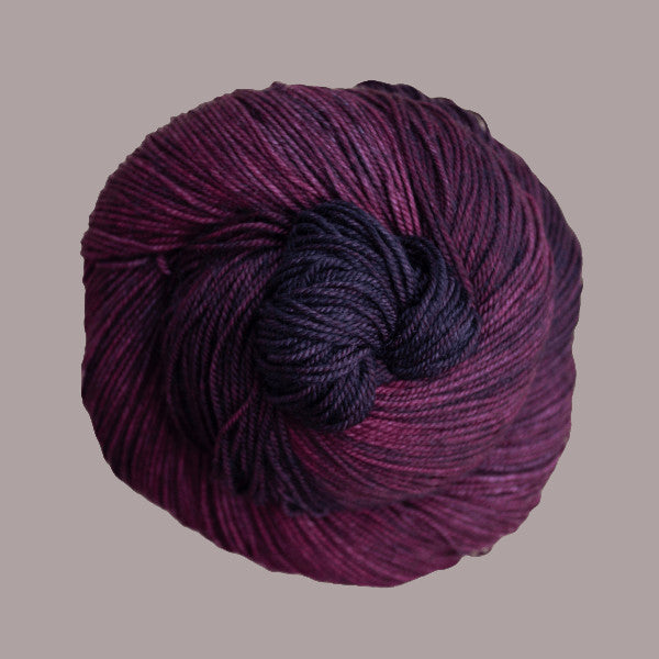 Malabrigo Sock Yarn in Swamp - a tonal mid to dark purple colorway