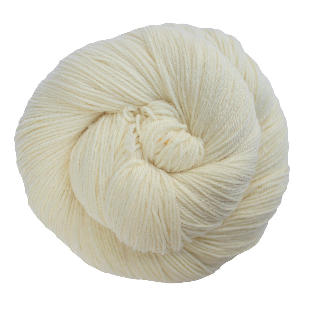 Color: Natural 063. A creamy white skein of Malabrigo Ultimate Sock yarn