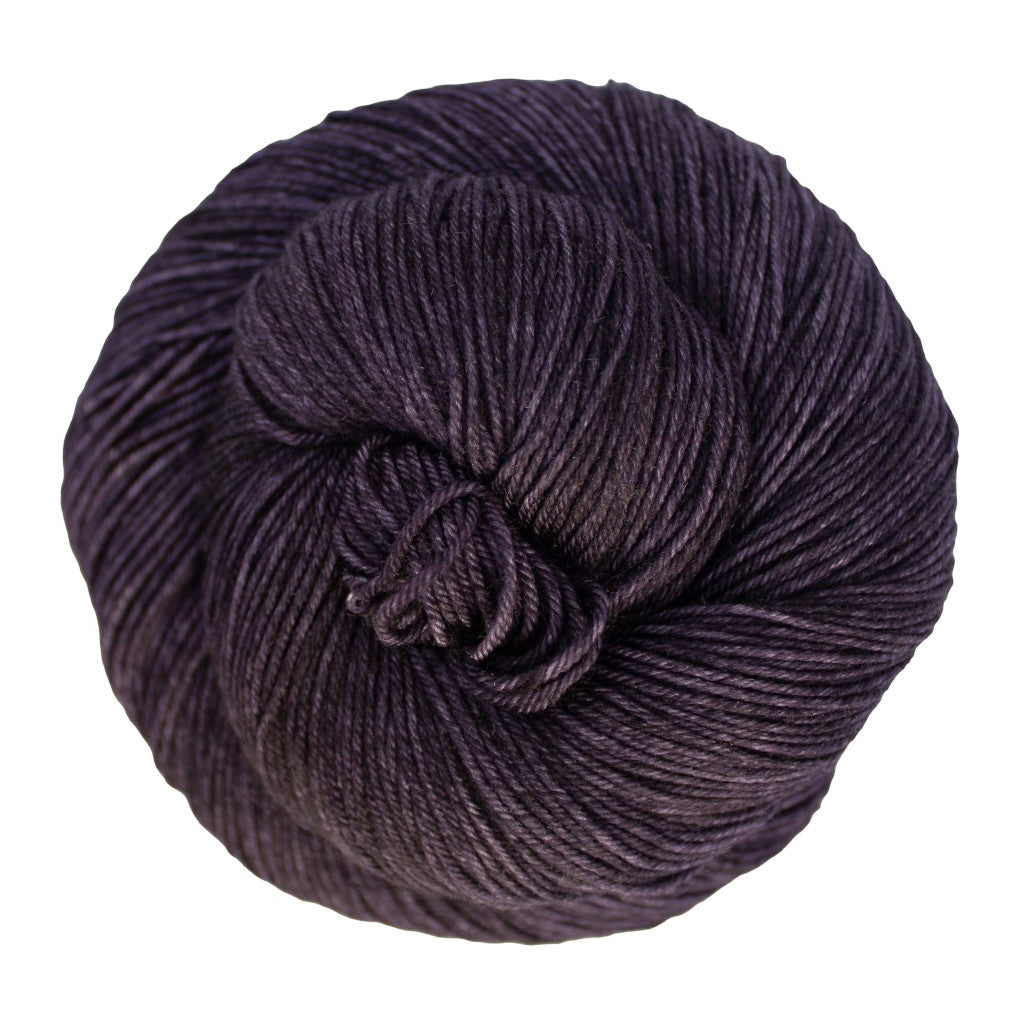 Color: Pearl Ten 069. A a dark, purplish grey variegated skein of Malabrigo Ultimate Sock yarn
