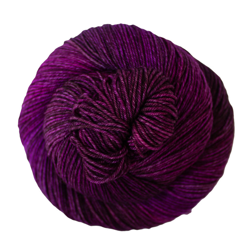 Color: Sabiduria 136. A deep purple and magenta variegated skein of Malabrigo Ultimate Sock yarn