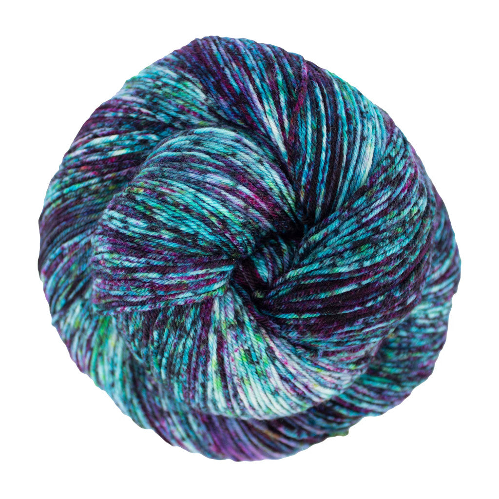 Color: Sur 164 . An aqua, purple, and white speckled skein of Malabrigo Ultimate Sock yarn