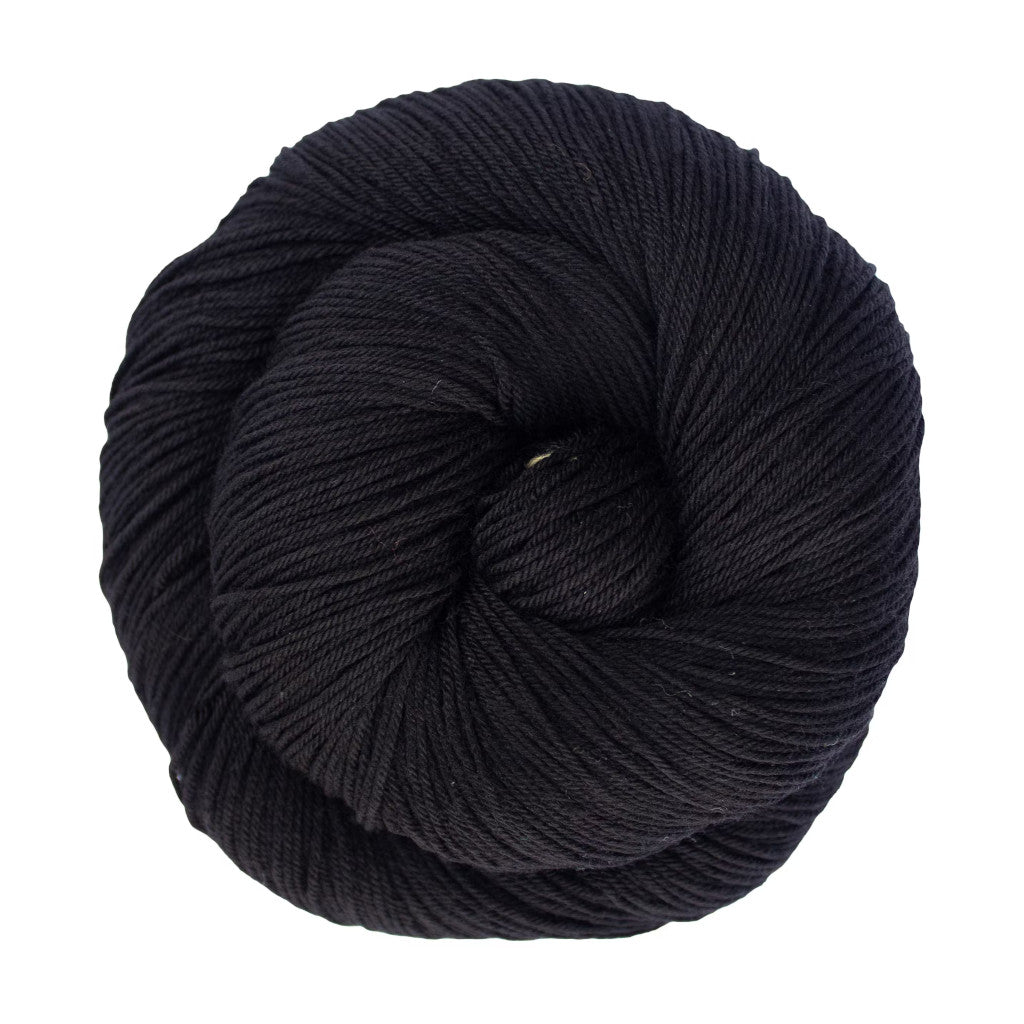 Color: Black 195 . A black skein of Malabrigo Ultimate Sock yarn