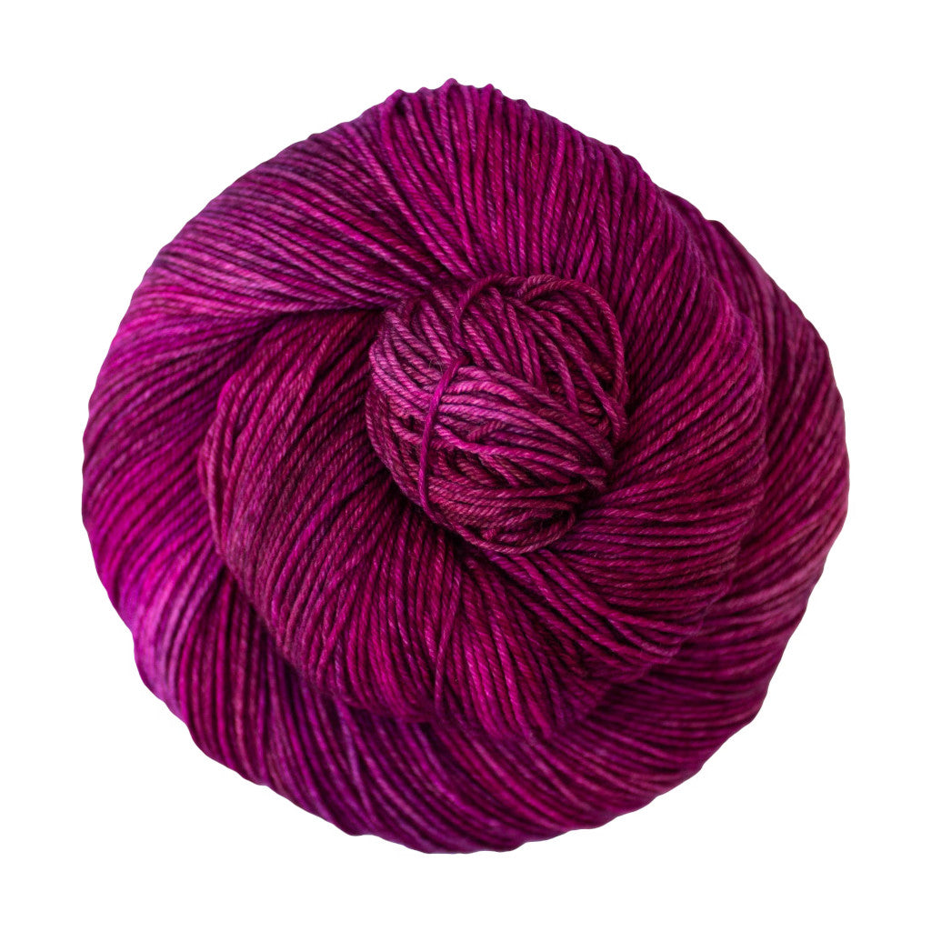 Color: Magenta 214. A magenta pink variegated skein of Malabrigo Ultimate Sock yarn