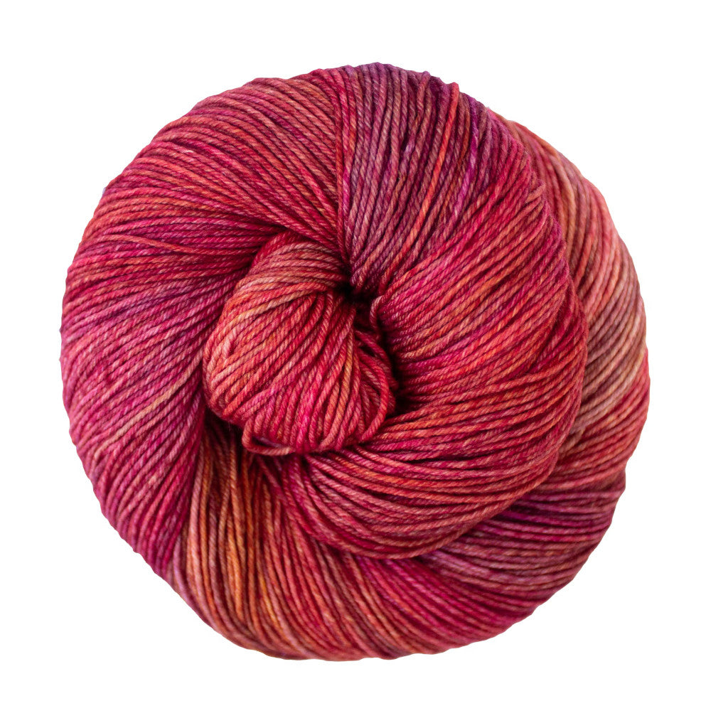 Color: Zinnias 658. An orangeish pink variegated skein of Malabrigo Ultimate Sock yarn
