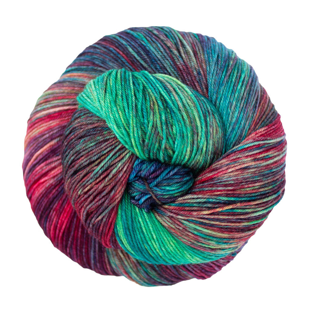 Color: Cameleon 684. A multicolored pink, purple and blue skein of Malabrigo Ultimate Sock yarn