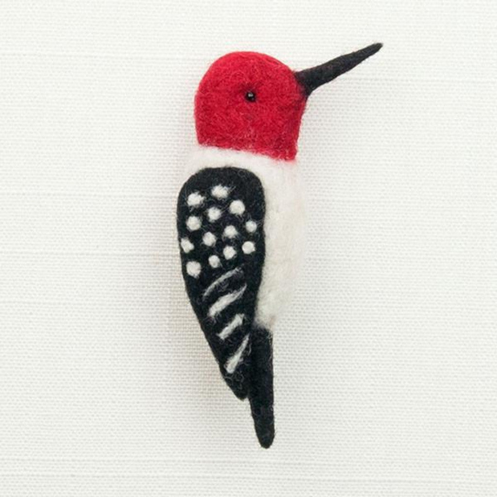 Woolpets woodpecker pin needle felting kit - a black and white felted woodpecker pin with red head