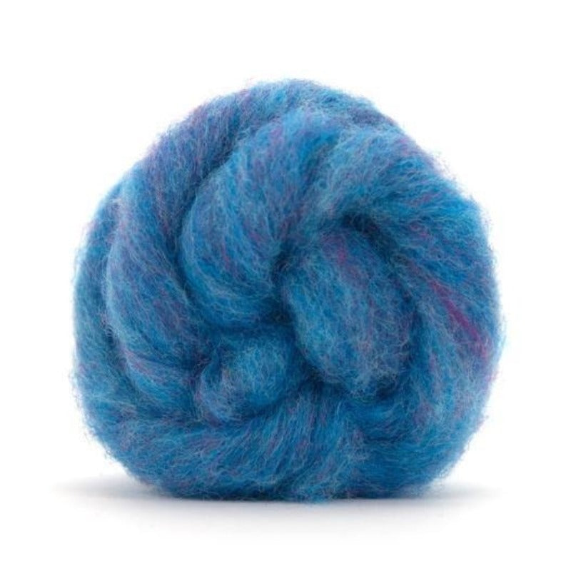 A blue and violet shade of carded corriedale wool roving.