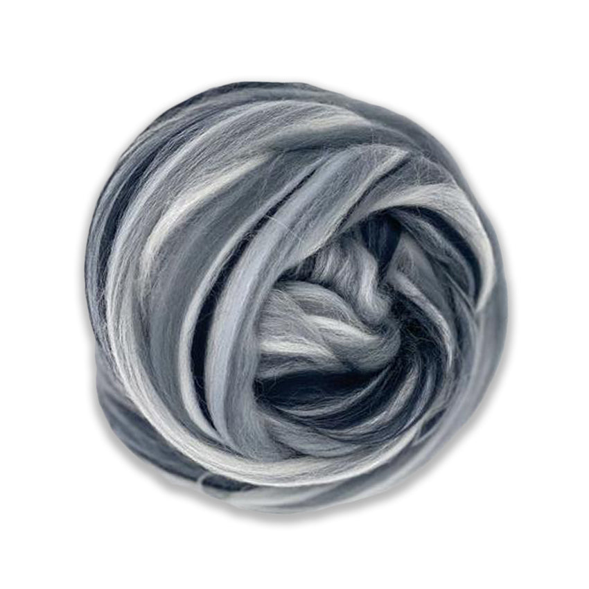 Color Tempest. A multi colored merino blend of black, white, pewter, and charcoal grey shades.