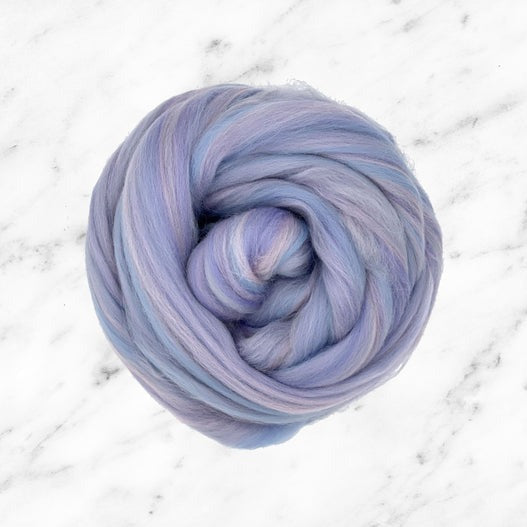 Color Twirl. A pastel blend of ultra soft merino wool top in the shades lavender, blue, and pink.
