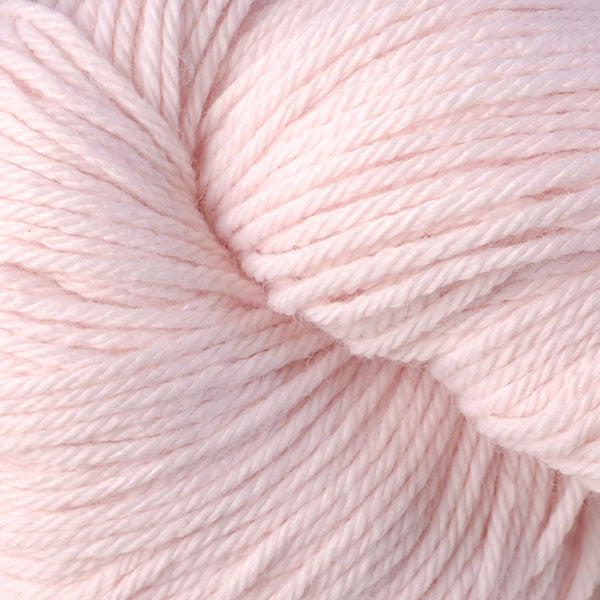 Berroco Vintage Worsted weight yarn in the color Fondant 5110, a light frosting pink.