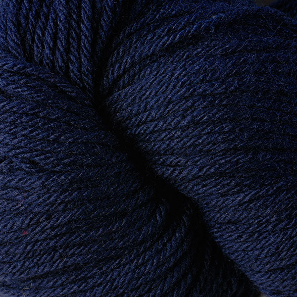 Berroco Vintage Worsted weight yarn in the color Dark Denim 5143, a deep navy blue.