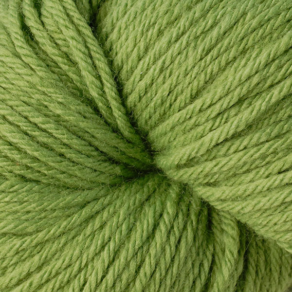 Berroco Vintage Worsted weight yarn in the color Envy 5162, a citrus green.