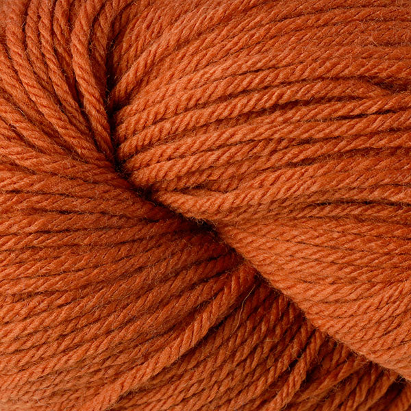 Berroco Vintage Worsted weight yarn in the color Tang 5164, a vibrant Halloween orange.