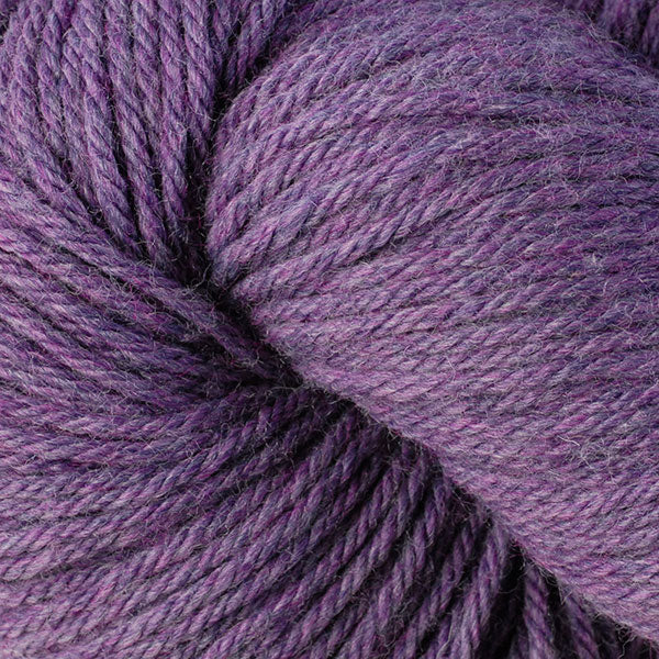 Berroco Vintage Worsted weight yarn in the color Lilacs 5183, a warm heathered purple.