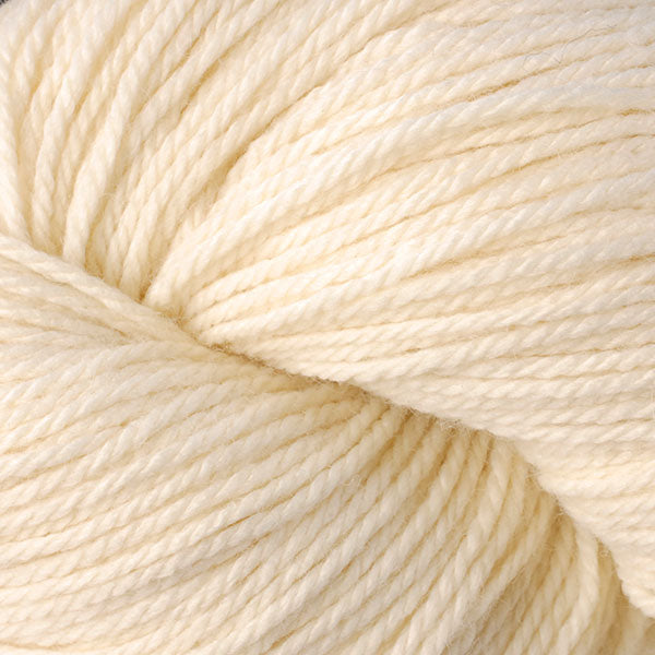 Berroco Vintage DK weight yarn in the color Buttercream 2102, a very pale yellowish off-white.