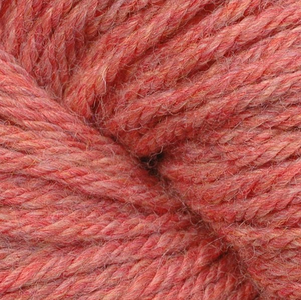 Berroco Vintage Worsted weight yarn in the color Macaron 5195, a bright heathered coral pink.