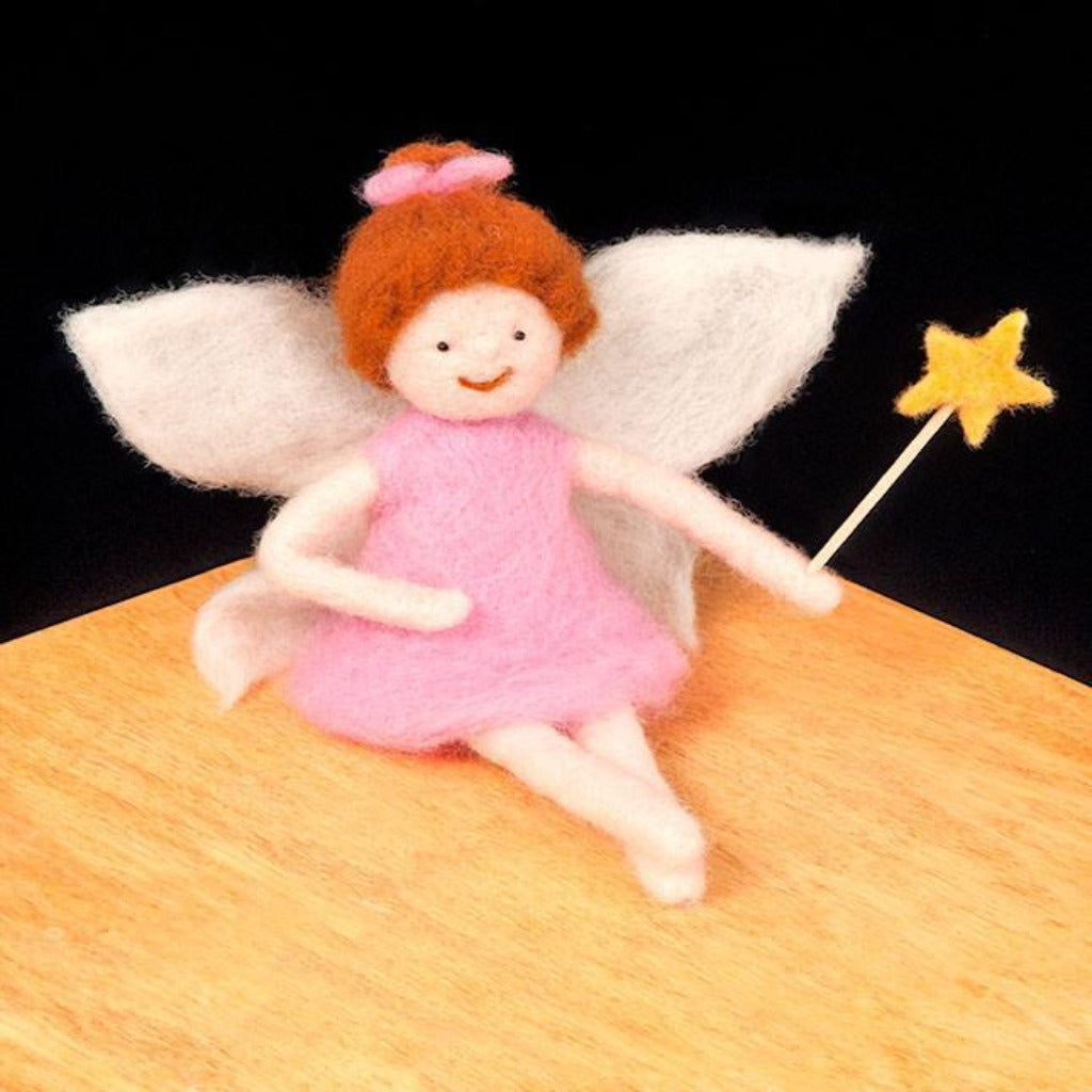 Woolpets fairy needle felting kit - a small fairy with red hair wearing a pink dress and holding a yellow star wand.