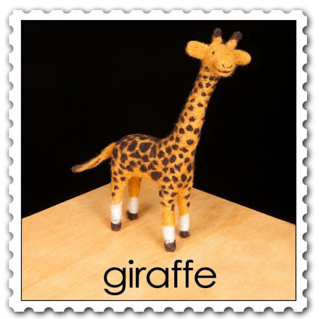 Woolpets giraffe needle felting kit - an orange giraffe with brown spots and white marks around the ankles
